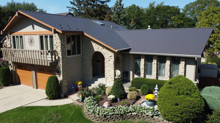 After: Tudor Brown Interlock Cedar Shingle aluminum roof on a Tudor Brown metal roof on a single-storey home with stone, Bartlett, Illinois