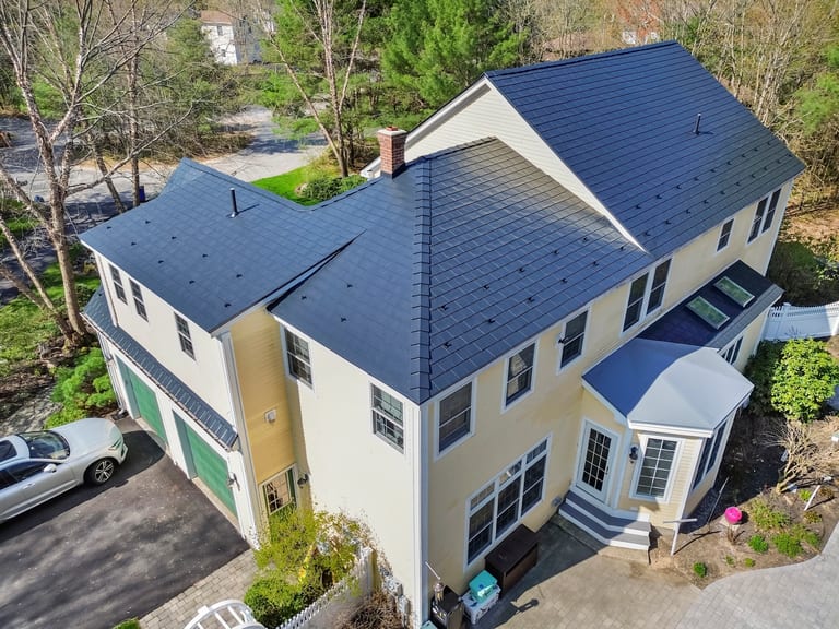 Black Interlock Slate aluminum roof on a two-storey colonial home with a slate metal roof in, Brunswick, Maine