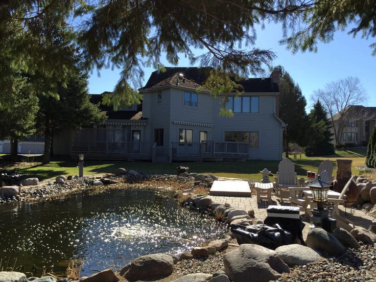 Before: Before: a worn out wood shake roof on the home, Mendota Heights, Minnesota, ahead of a Weathered Interlock Shake aluminum roof