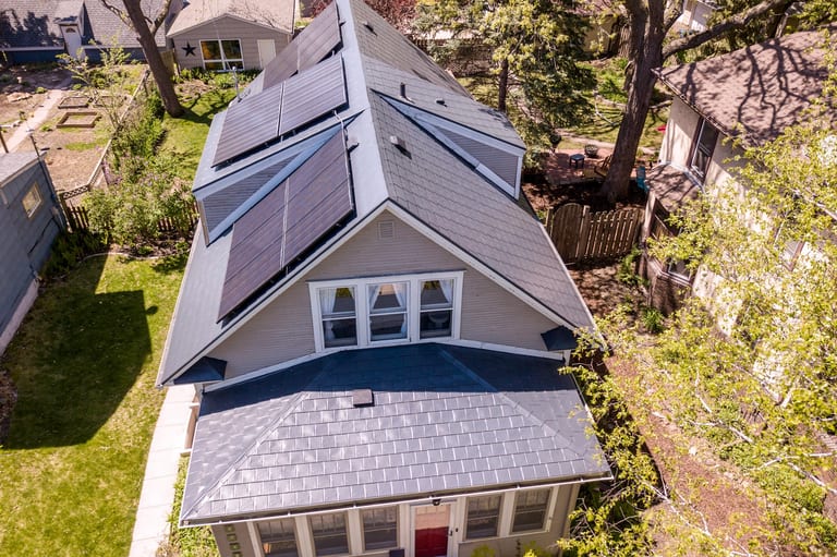 Deep Charcoal Interlock Slate aluminum roof on a single-family home with a metal roof in a urban setting, Minneapolis, Minnesota