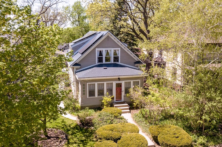 Deep Charcoal Interlock Slate aluminum roof on a two-storey craftsman home with a slate metal roof among, Minneapolis, Minnesota