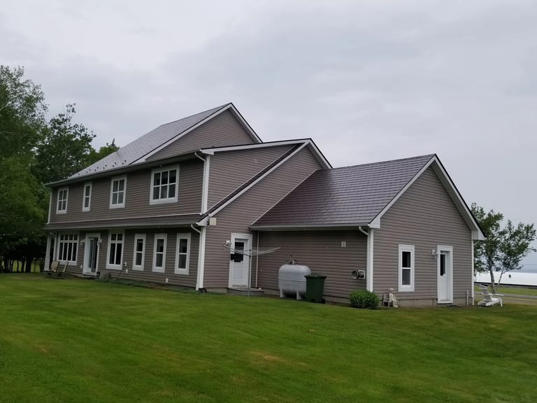 Tudor Brown Interlock Slate aluminum roof on the home, Canning, Nova Scotia