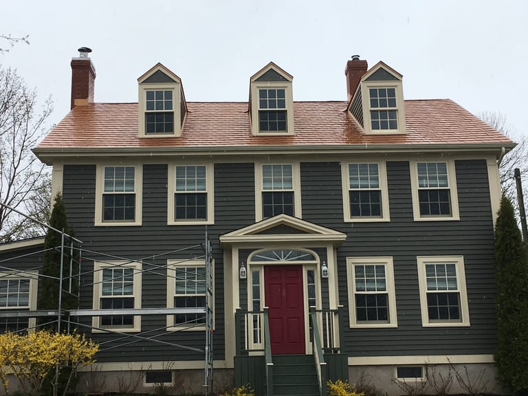 Copper Penny Interlock Slate aluminum roof on the home with chimney, Granville Ferry, Nova Scotia