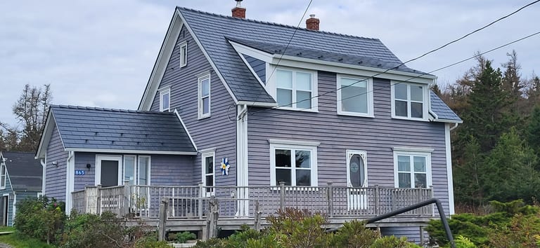 Deep Charcoal Interlock Cedar Shingle aluminum roof on the home, Kingsburg, Nova Scotia