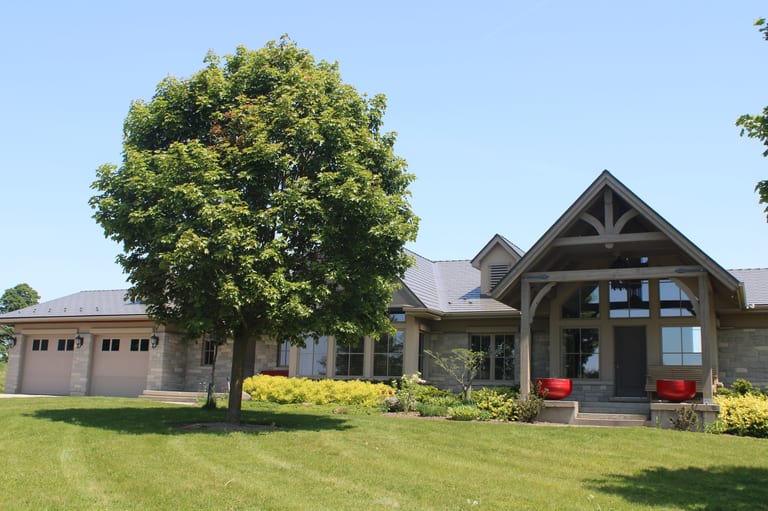 Musket Grey Interlock Cedar Shingle aluminum roof on a single-storey house with a metal roof in a rural setting, Guelph, Ontario