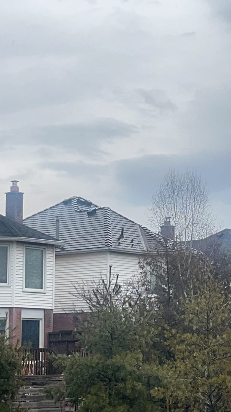 Colonial-style home in Burlington ON with Interlock Colonial Brown cedar shingle aluminum metal roofing on a multi-hip complex roof, viewed from rear-left elevation.