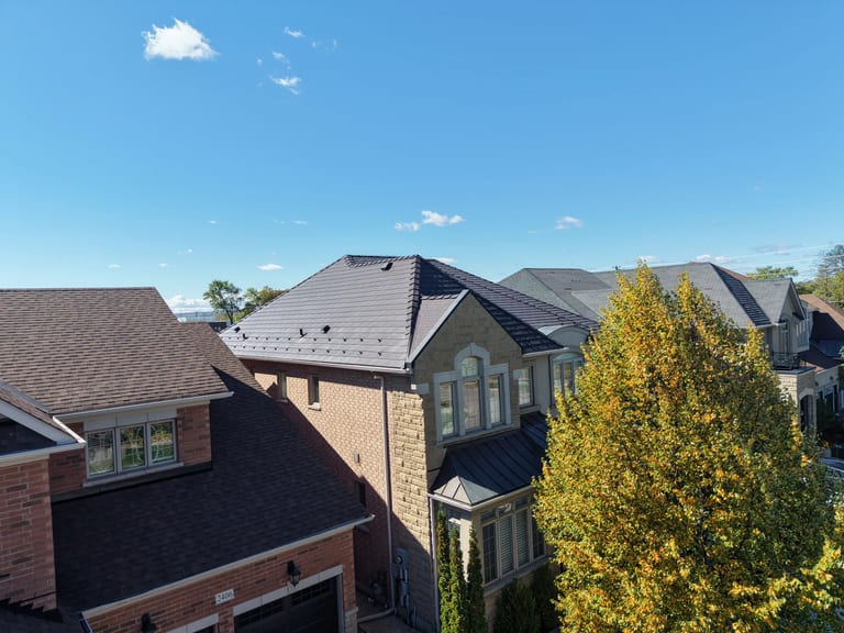 Tudor Brown Interlock Cedar Shingle aluminum roof on a brown two-storey home with dormers in a suburban setting, Oakville, Ontario
