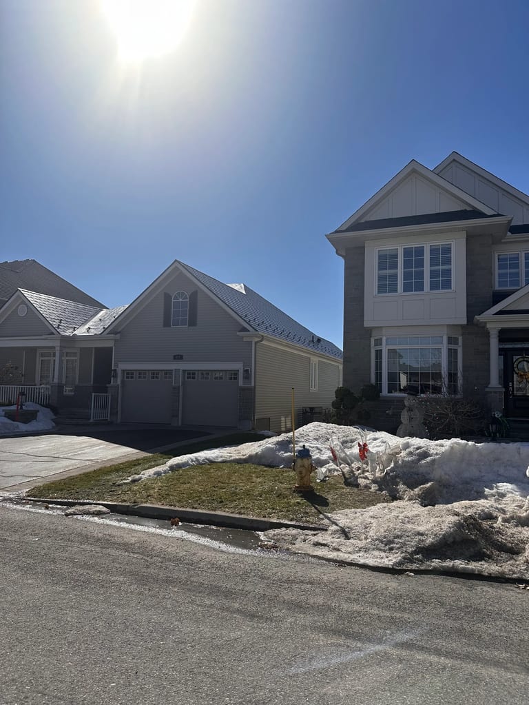 Black Interlock Slate aluminum roof on a colonial-style single-family home in a suburban, Ottawa, Ontario