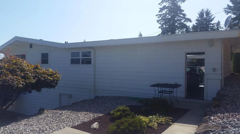 Before: Before: the old roof on the home, Des Moines, Washington, ahead of a Black Interlock Standing Seam aluminum roof