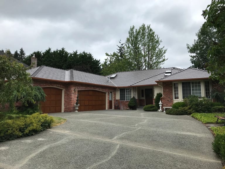 After: Tudor Brown Interlock Cedar Shingle aluminum roof on a Tudor Brown metal roof on a ranch style home in a, Mill Creek, Washington