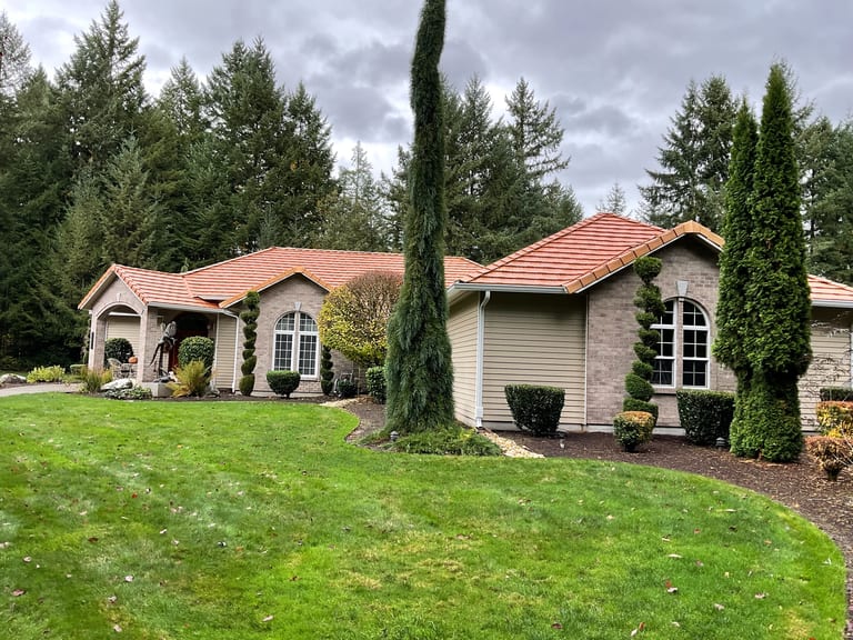 After: Copper Penny Interlock Shake aluminum roof on a tan one-storey home with a copper penny metal roof in a, Auburn, Washington