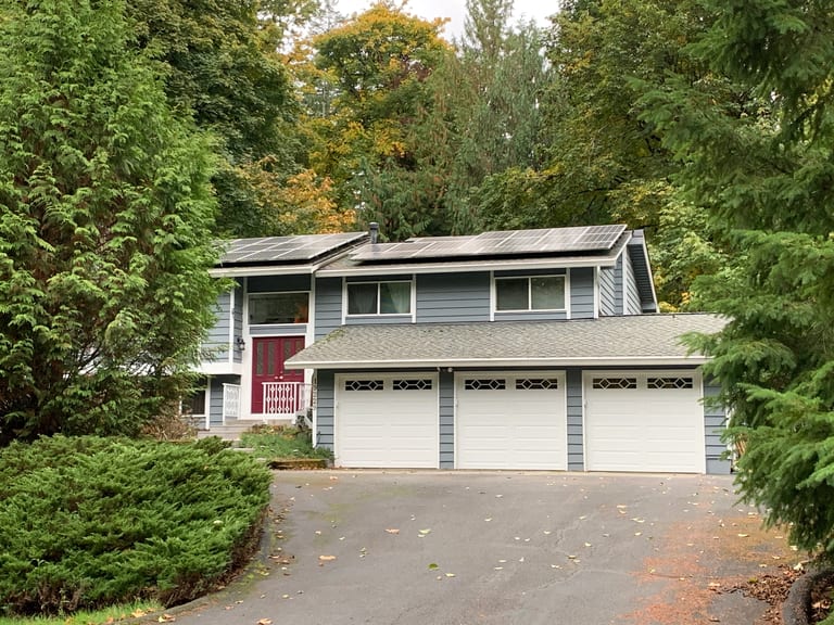 Before: Before: a worn out asphalt shingle roof on the home, Woodinville, Washington, ahead of a Deep Charcoal Interlock Slate aluminum roof