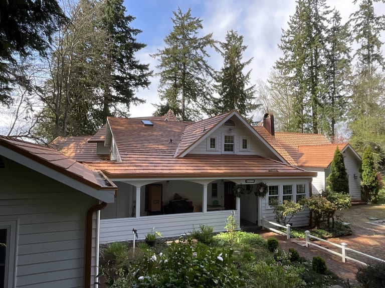 After: Copper Penny Interlock Shake aluminum roof on a cottage-style home with a copper penny metal roof in a, Bremerton, Washington
