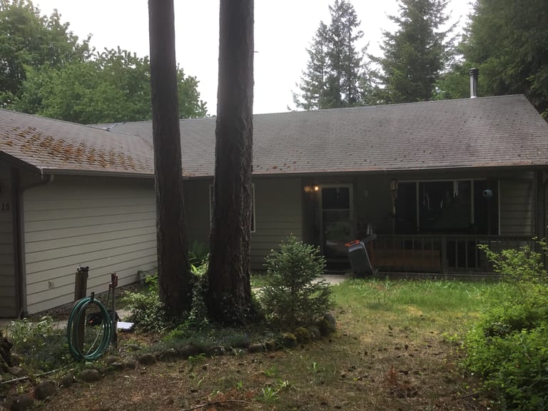 Before: Before: a worn out asphalt shingle roof on the home, Tenino, Washington, ahead of a Deep Charcoal Interlock Cedar Shingle aluminum roof