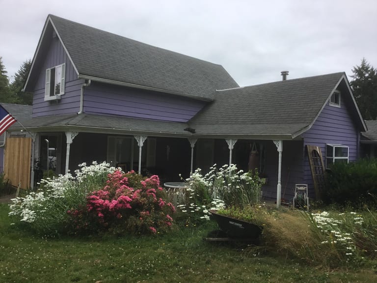 Before: Before: a worn out asphalt shingle roof on the home, Olympia, Washington, ahead of a Copper Penny Interlock Cedar Shingle aluminum roof