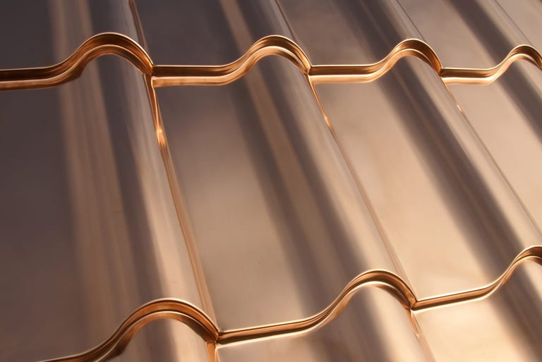 Interlock® Solid Copper Cedar Shingle Roofing installations at various stages of natural patina development on Colonial and Craftsman residential architecture