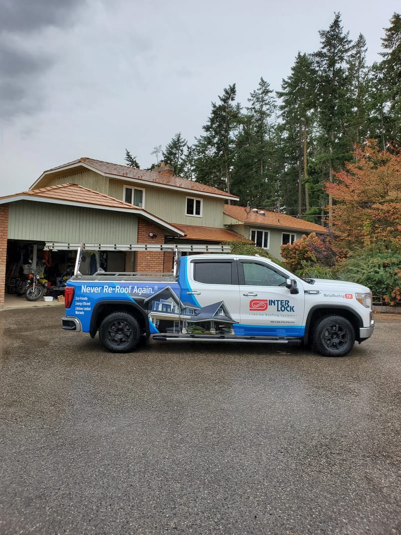 Copper Penny Interlock Slate aluminum roof on a two-storey home with a metal roof under construction in a, Armstrong, British Columbia