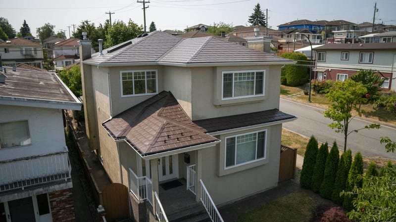 Colonial Brown Interlock Slate aluminum roof on a colonial style home in an urban suburb, Vancouver, British Columbia