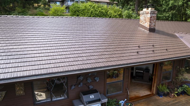 Colonial Brown Interlock Cedar Shingle aluminum roof on a brown one-storey home with a colonial style and a metal, Salt Spring Island, British Columbia