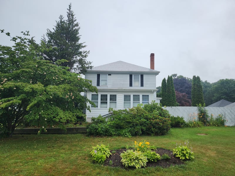 Deep Charcoal Interlock aluminum metal shingle roof on a Connecticut home in Danielson