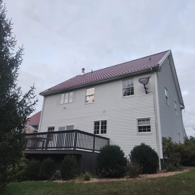 Interlock Mediterranean tile metal roof in Tile Red, Oxford, CT, residential installation.