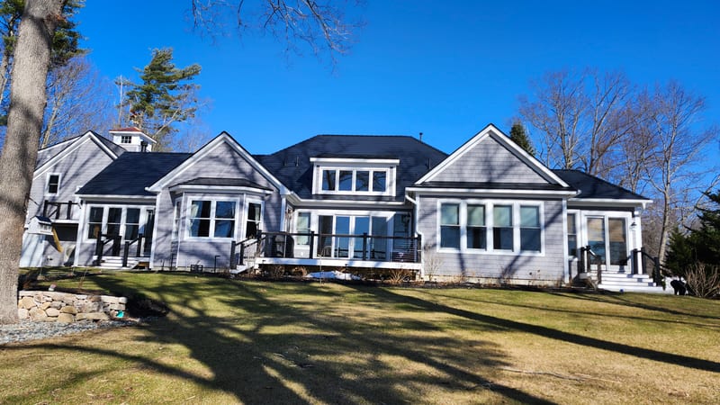 Interlock Slate aluminum metal roof in Deep Charcoal on a home in Orrs Island, Maine.