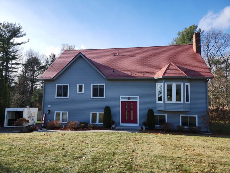 Tile Red Interlock metal shingle roof on a Massachusetts home in Stoughton