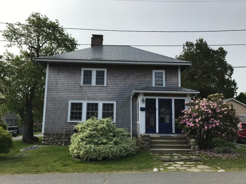 Charcoal Grey Interlock Slate aluminum roof on a Rockport, Massachusetts home.
