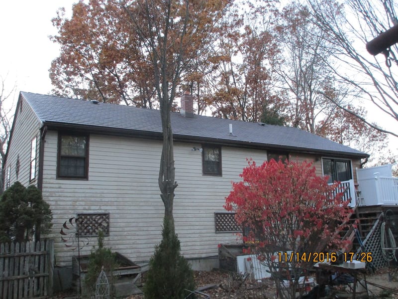 Colonial Brown Interlock cedar shingle metal roof installation in Haverhill, MA.