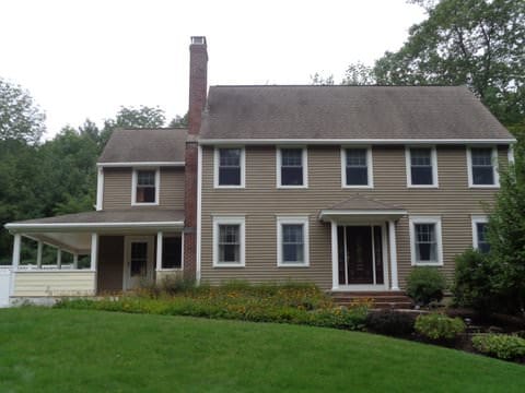 Colonial Brown Interlock Slate metal roofing on a Massachusetts home in Rochdale