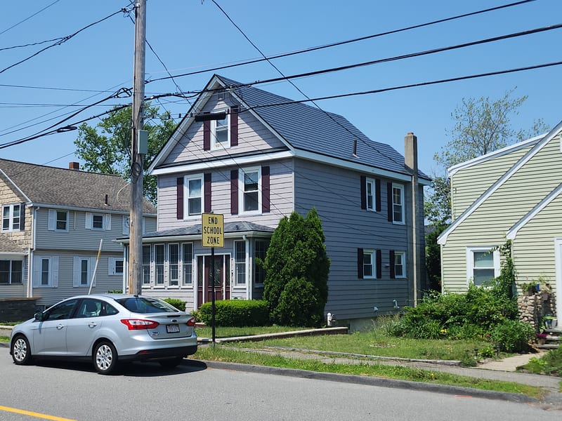 Deep Charcoal Interlock Slate metal roof on a Saugus, MA home, with lifetime warranty.