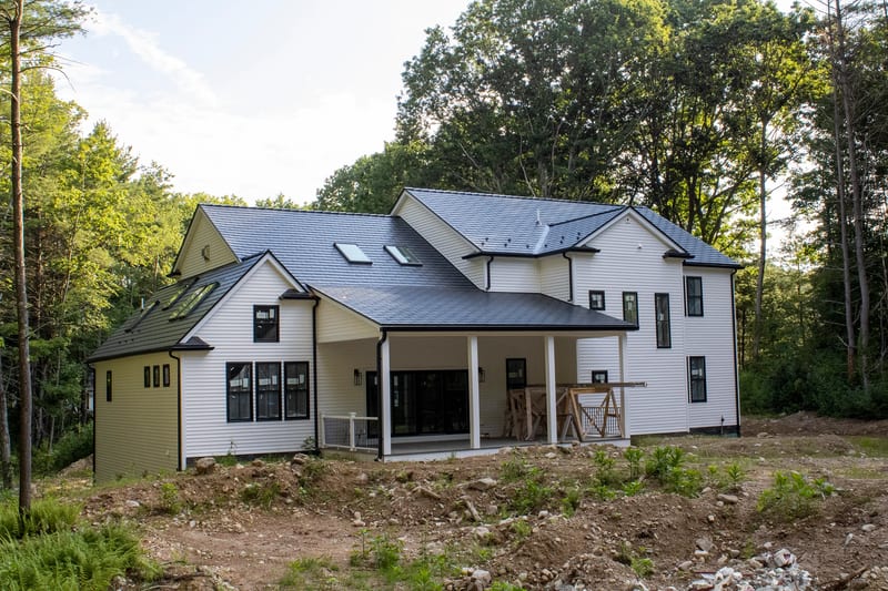Black Interlock slate metal roofing on a Foxborough, Massachusetts home.