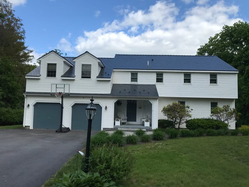 Chelmsford, MA home with Interlock Slate metal roofing in Deep Charcoal.
