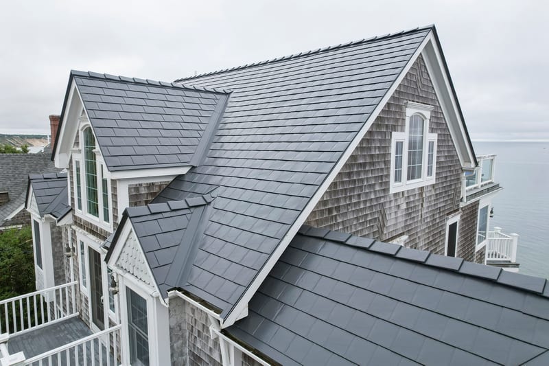 Deep Charcoal Interlock Slate metal roofing on a coastal Massachusetts home in Sagamore Beach.