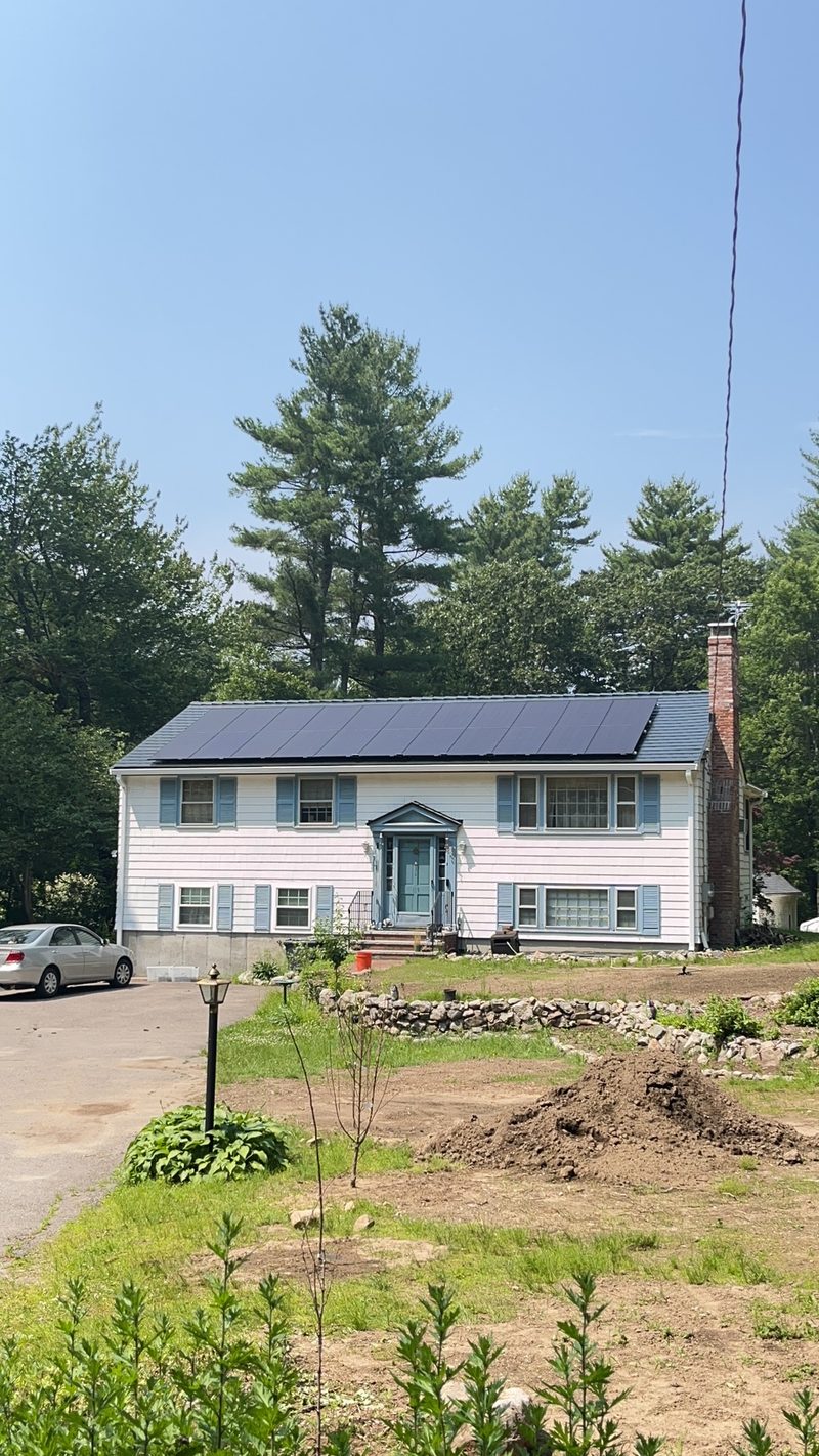 Norfolk, Massachusetts home with Interlock Slate metal roofing and solar panels.