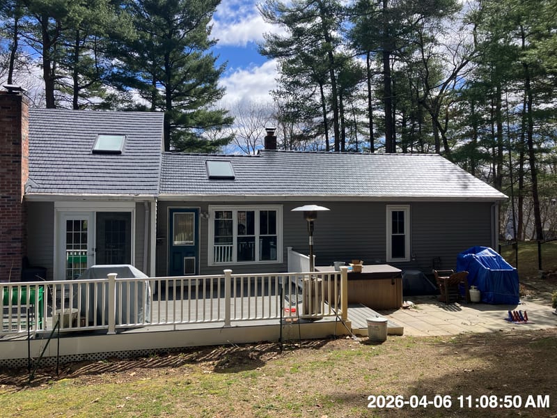 Black Interlock cedar shingle aluminum metal roof installation in Stoughton, Massachusetts.
