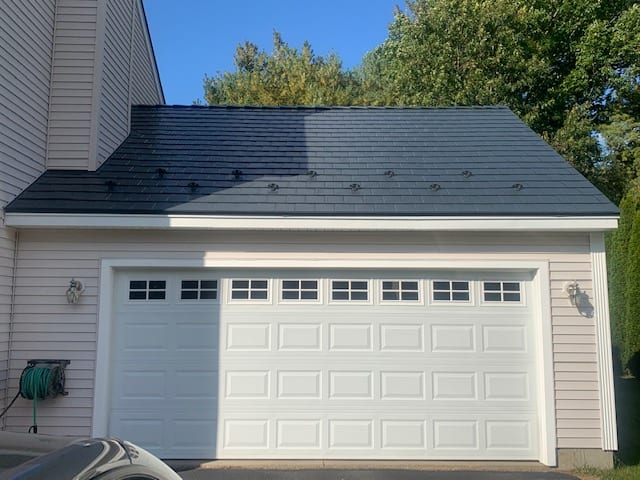 Deep Charcoal Interlock Slate metal roofing on a New Hampshire home in Merrimack.
