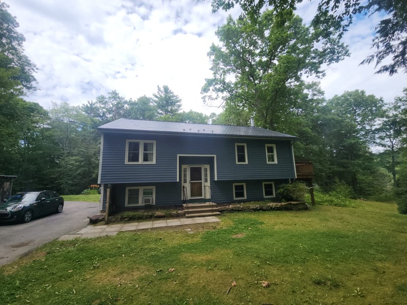 Deep Charcoal Interlock Slate metal roof on a home in Bow, New Hampshire.