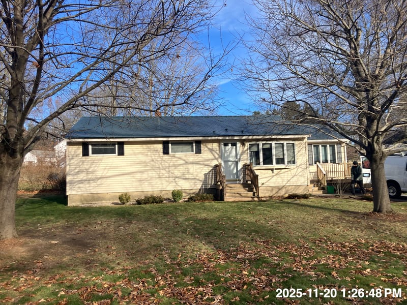 Hunter Green Interlock Slate aluminum metal roof installed in Dover, New Hampshire home