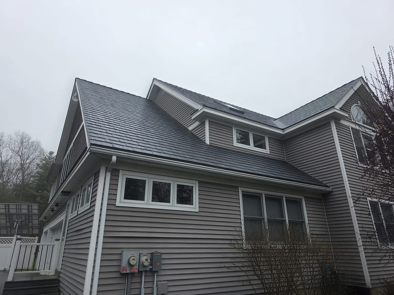 Interlock Slate aluminum metal roof in Deep Charcoal, Pelham, NH residential installation.