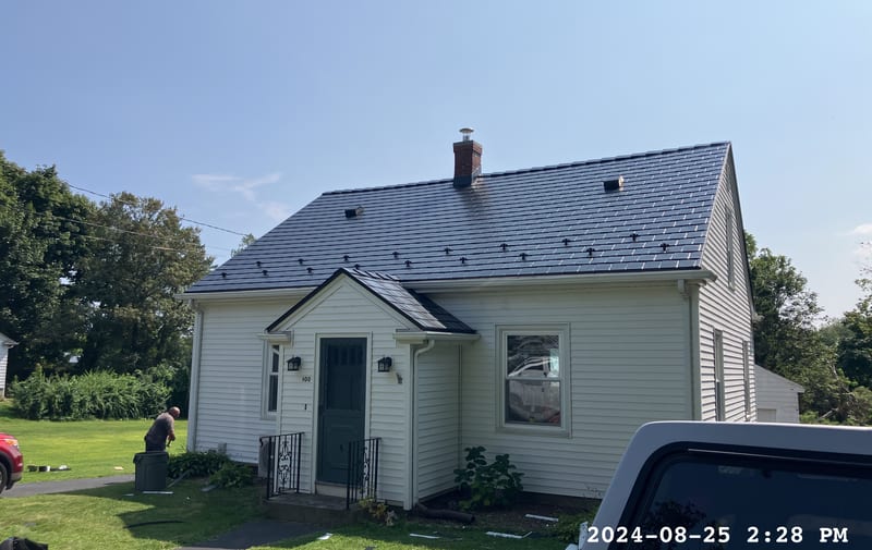 Black Interlock Slate aluminum metal roof installed in Portsmouth, Rhode Island, with lifetime warranty.