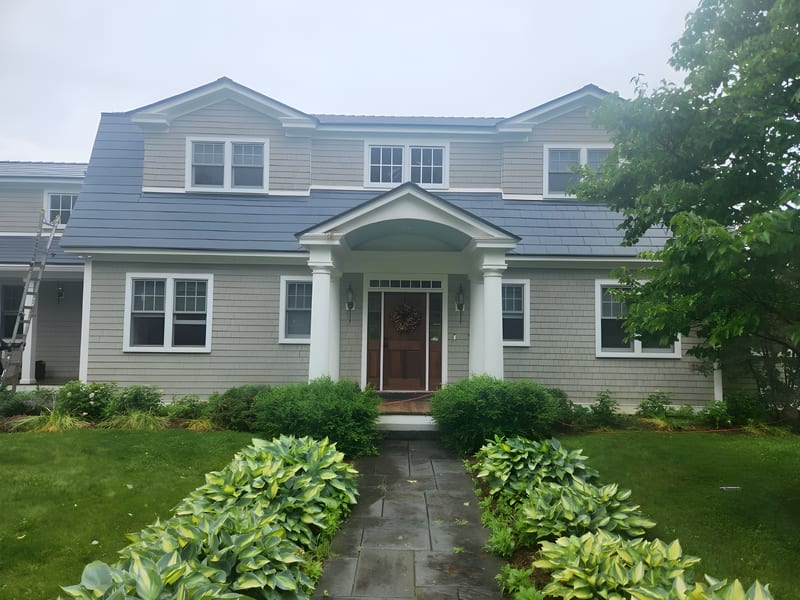 Deep Charcoal Interlock Slate aluminum metal roof on a Panton, Vermont home.