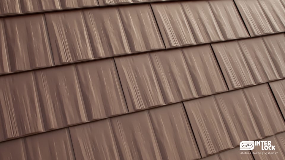 Close-up of Interlock® Metal Cedar Shingle panels — embossed cedar wood-grain texture in aluminum
