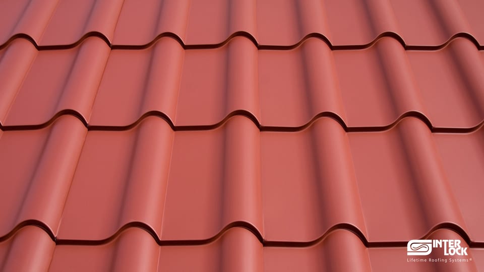 Close-up of Interlock® Mediterranean Metal Tile panels in Tile Red — clay-tile S-profile in aluminum