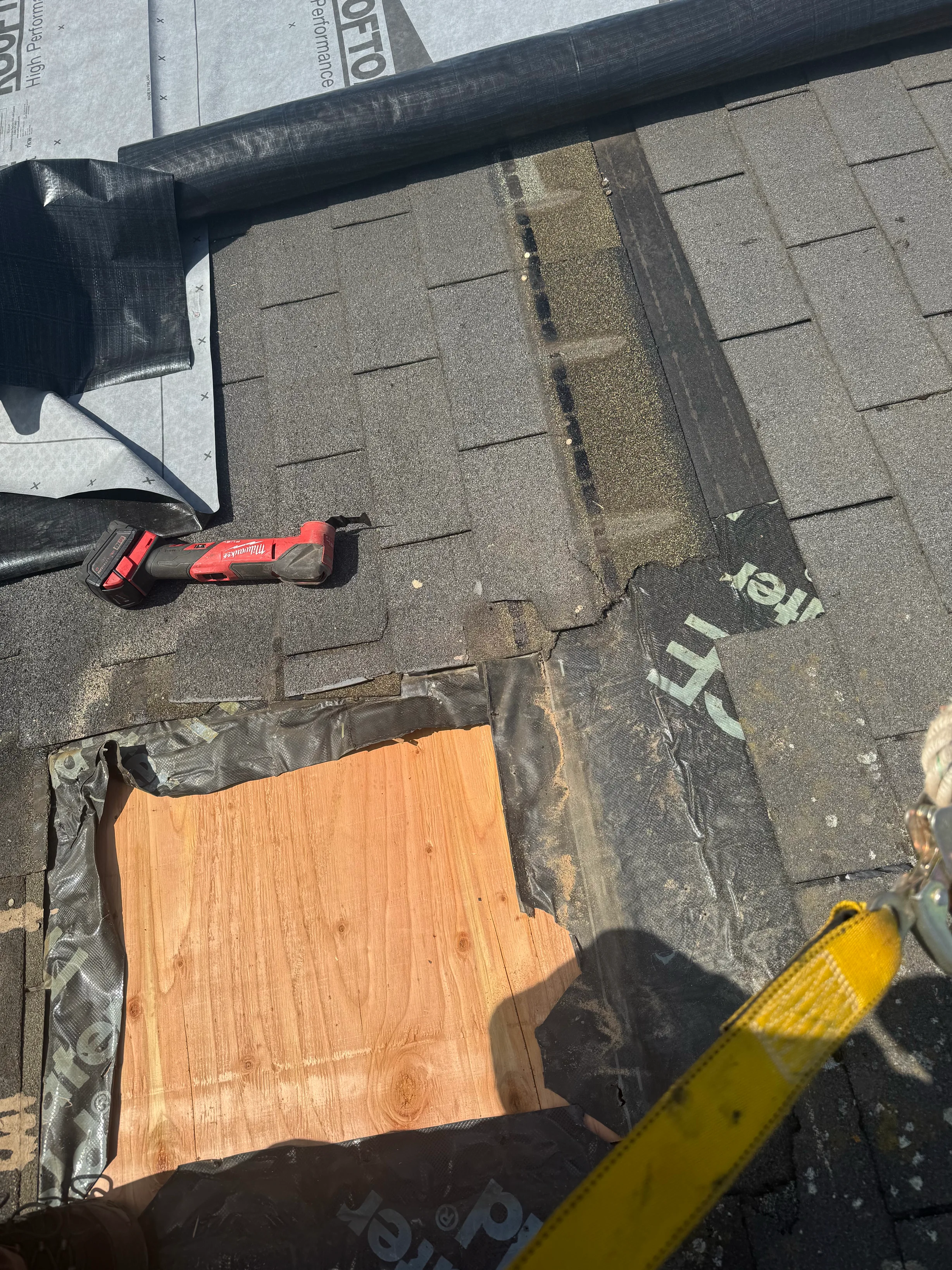 A metal roof being installed with underlayment visible