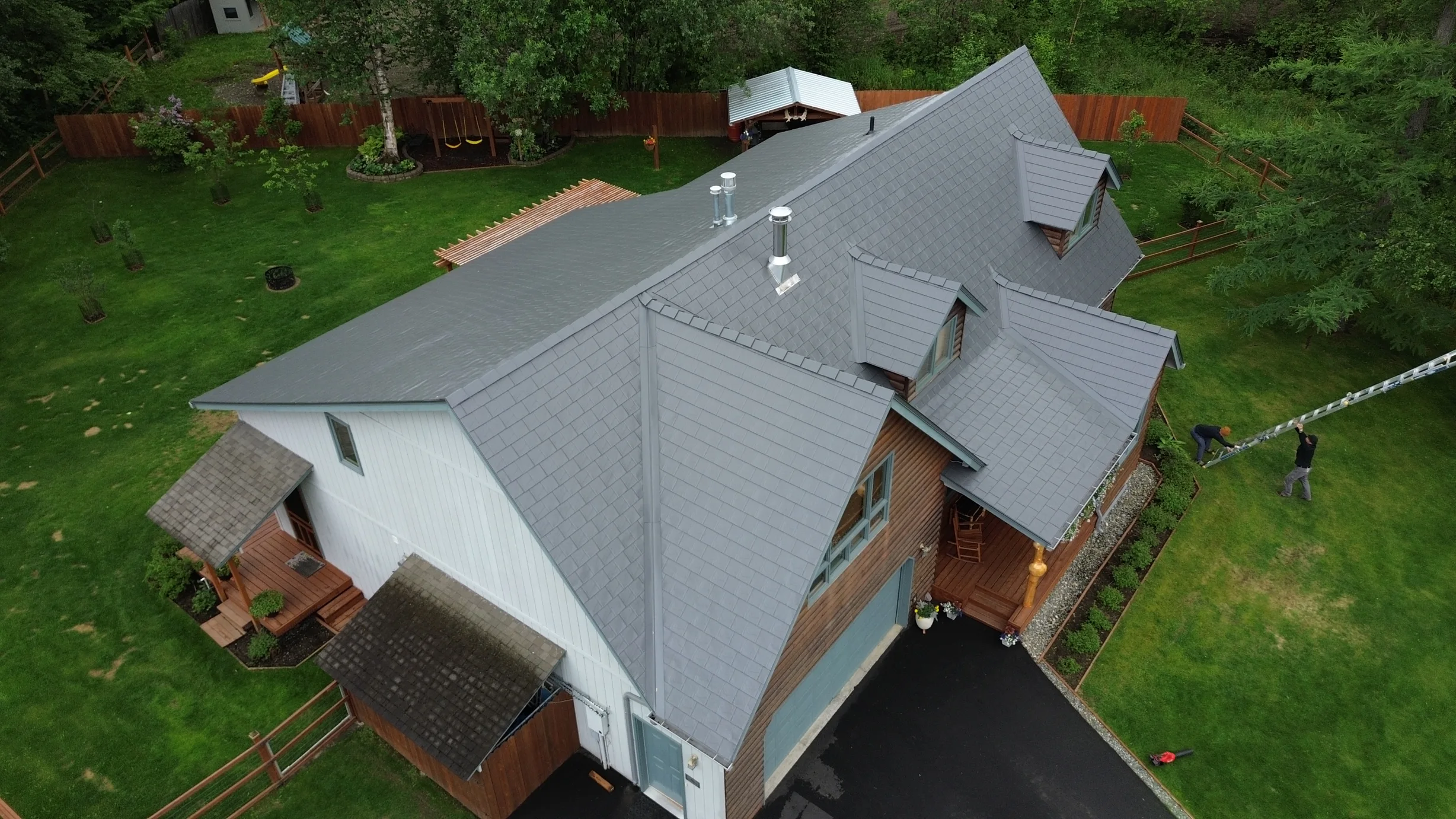Metal roof in a modern style on a single-family home in a rural setting