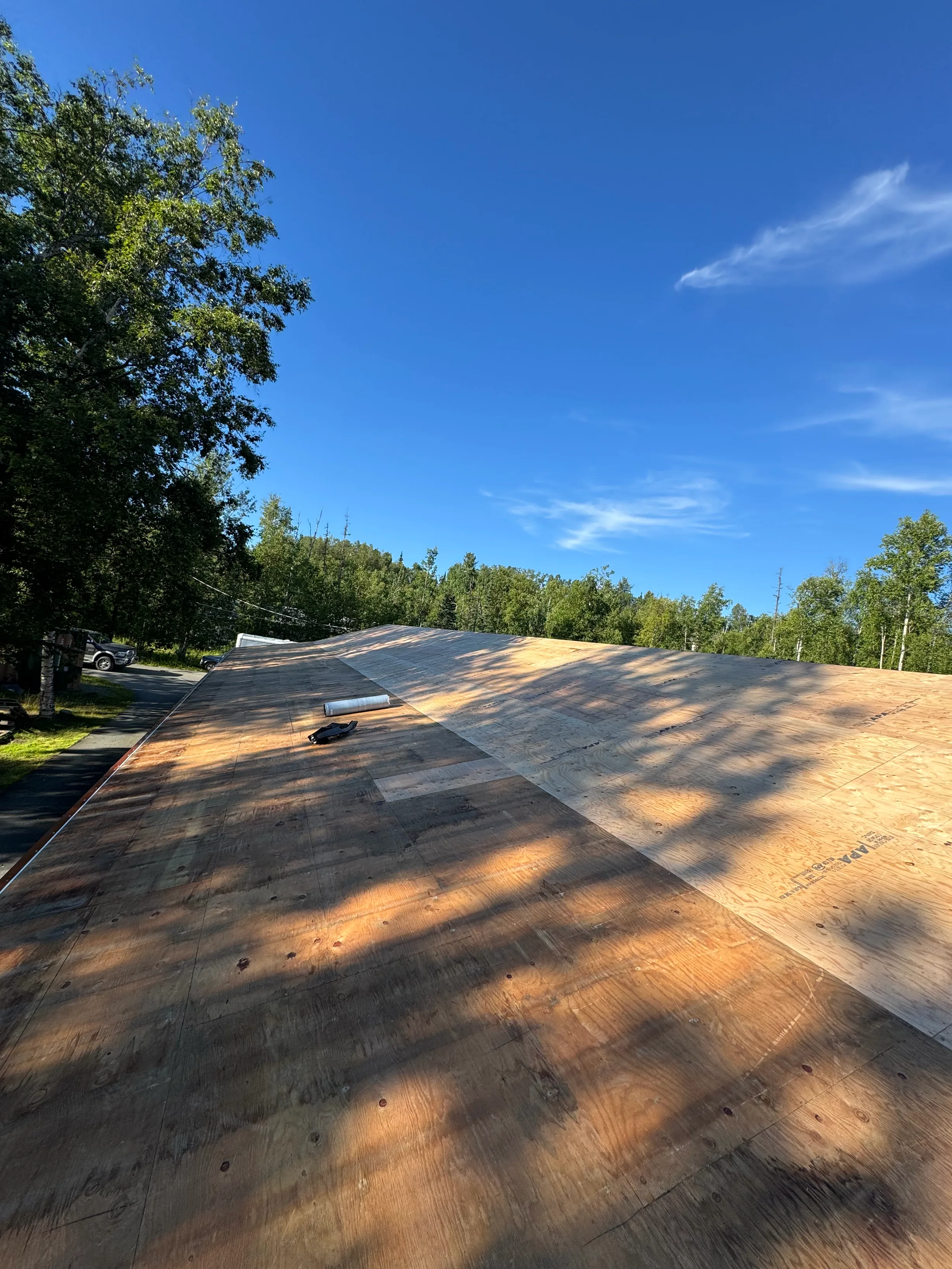 Copper Penny Interlock Shake aluminum roof being installed on the home, Wasilla, Alaska