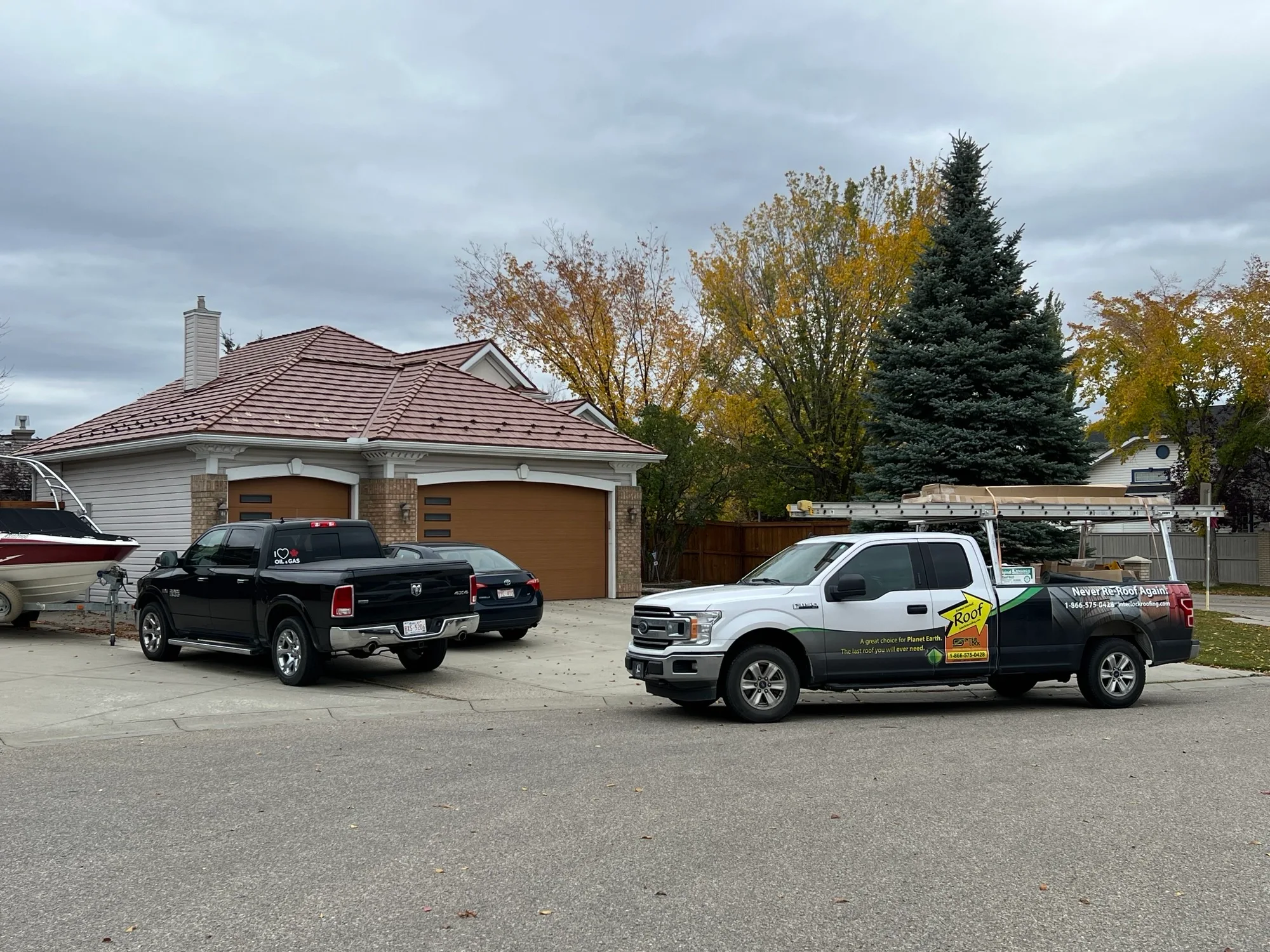 Aged Copper Interlock Shake aluminum roof on a single-storey home with a garage in a suburban, Calgary, Alberta