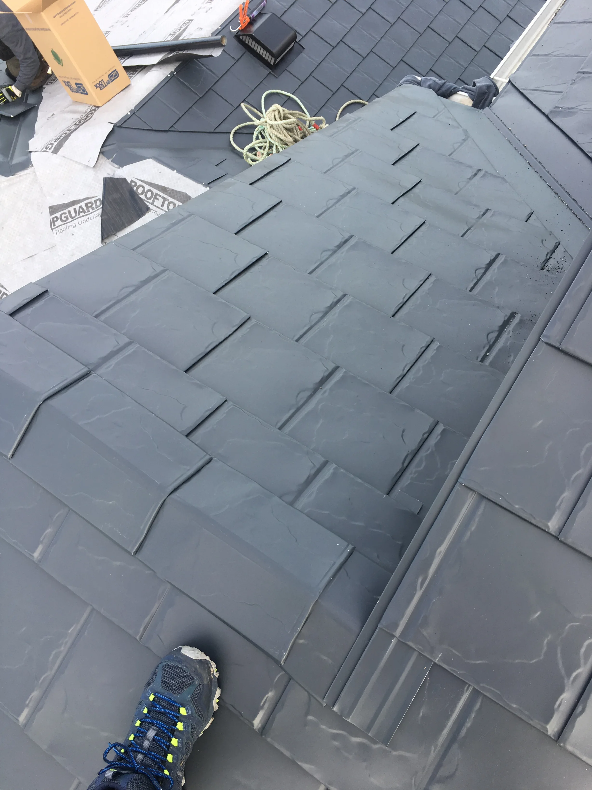 Deep Charcoal Interlock Slate aluminum roof on a two-storey home with a metal roof in Deep Charcoal among, Fort Saskatchewan, Alberta