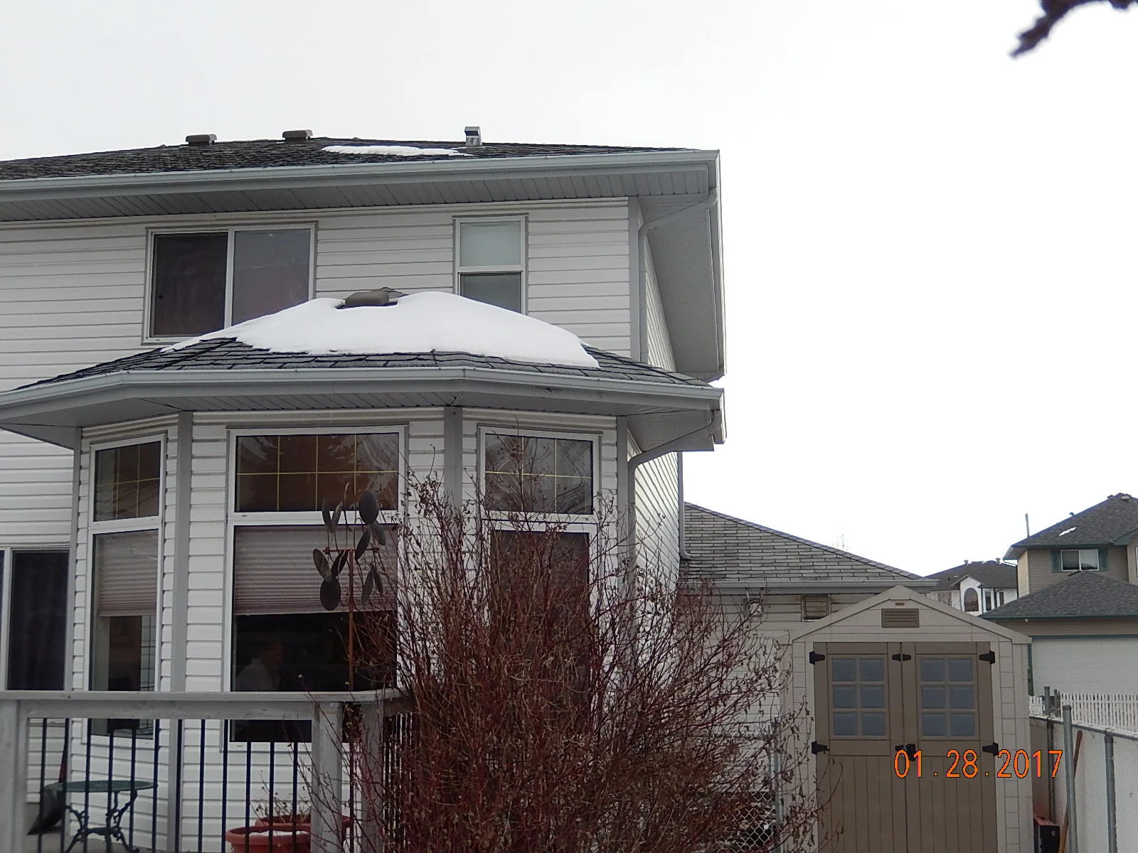Deep Charcoal Interlock Slate aluminum roof on a white two-storey home with dormers in a snowy rural, Fort Saskatchewan, Alberta